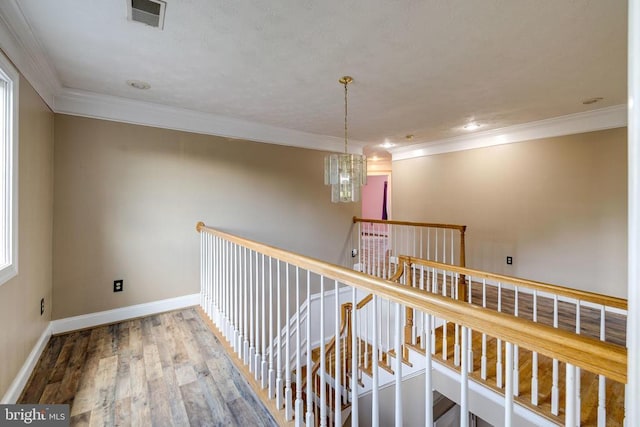 369 Eldon Yates Dr, Stanley, VA 22851 - hallway with crown molding, an upstairs landing, wood finished floors, and a chandelier