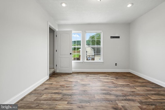 369 Eldon Yates Dr, Stanley, VA 22851 - spare room with wood finished floors, recessed lighting, and a textured ceiling