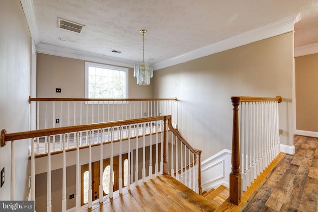 369 Eldon Yates Dr, Stanley, VA 22851 - stairs with crown molding, wood finished floors, and a chandelier
