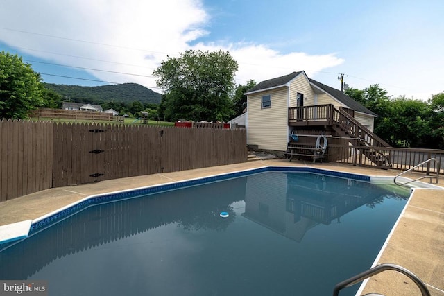 369 Eldon Yates Dr, Stanley, VA 22851 - view of swimming pool with stairway and a deck with mountain view