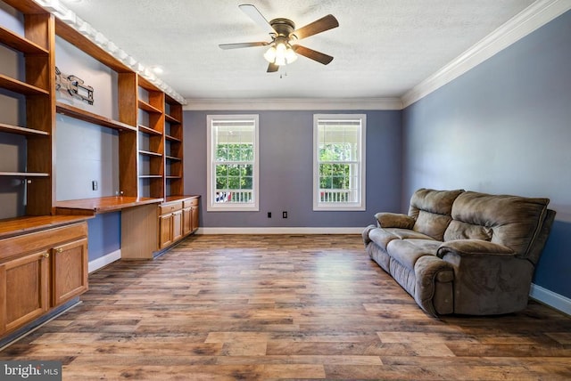 369 Eldon Yates Dr, Stanley, VA 22851 - living area featuring built in desk, crown molding, a ceiling fan, dark wood-style flooring, and a textured ceiling