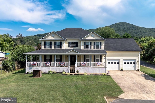 369 Eldon Yates Dr, Stanley, VA 22851 - view of front facade featuring a porch, an attached garage, driveway, and a front yard