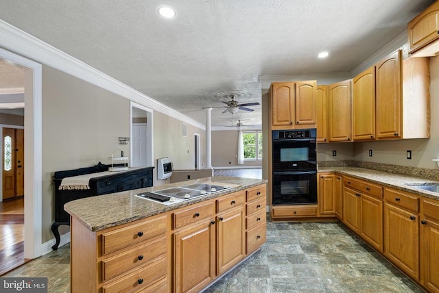 369 Eldon Yates Dr, Stanley, VA 22851 - kitchen with stovetop with downdraft, crown molding, a ceiling fan, a kitchen island, and light stone countertops