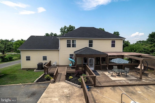 369 Eldon Yates Dr, Stanley, VA 22851 - back of property featuring a wooden deck, a lawn, and roof with shingles