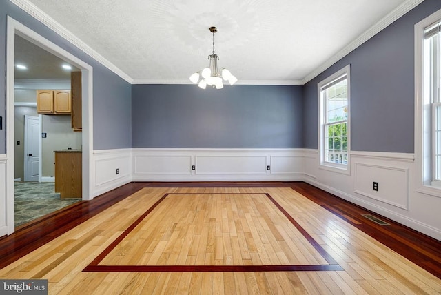 369 Eldon Yates Dr, Stanley, VA 22851 - empty room with hardwood / wood-style floors, a chandelier, wainscoting, and crown molding