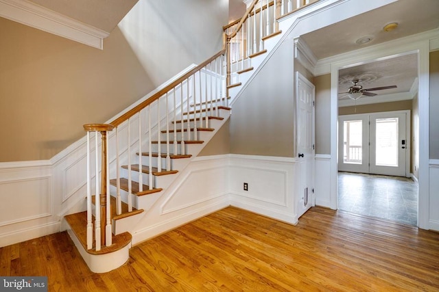 369 Eldon Yates Dr, Stanley, VA 22851 - staircase with a decorative wall, crown molding, ceiling fan, wood finished floors, and wainscoting