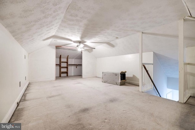 369 Eldon Yates Dr, Stanley, VA 22851 - additional living space with a textured ceiling, vaulted ceiling, carpet, and ceiling fan