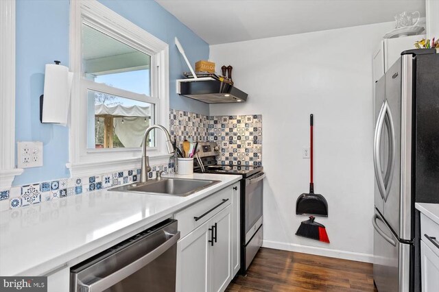 8952 Courthouse Rd, Spotsylvania, VA 22553 - kitchen with stainless steel appliances, a sink, white cabinetry, dark wood-style floors, and light countertops