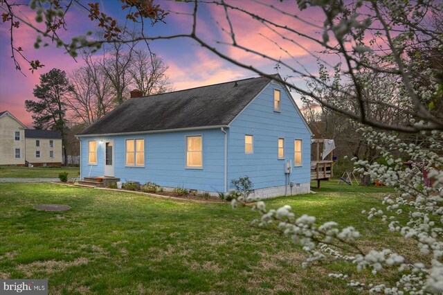 8952 Courthouse Rd, Spotsylvania, VA 22553 - view of property exterior with a chimney, a lawn, and a shingled roof