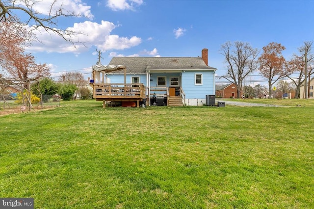 8952 Courthouse Rd, Spotsylvania, VA 22553 - rear view of property featuring a deck, central AC unit, a lawn, and a chimney