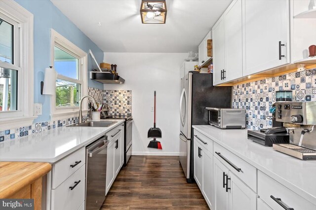 8952 Courthouse Rd, Spotsylvania, VA 22553 - kitchen with open shelves, appliances with stainless steel finishes, a sink, light countertops, and decorative backsplash
