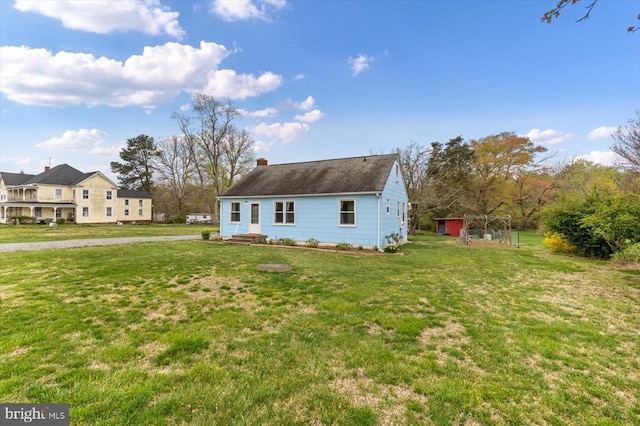8952 Courthouse Rd, Spotsylvania, VA 22553 - view of front of property with a front lawn, an outdoor structure, and a shed