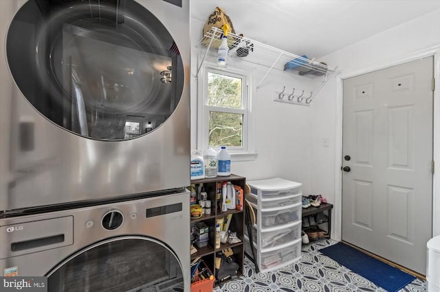 8952 Courthouse Rd, Spotsylvania, VA 22553 - laundry area with stacked washer and clothes dryer and tile patterned flooring