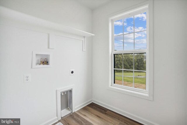  - washroom featuring hookup for an electric dryer, washer hookup, baseboards, and dark wood finished floors