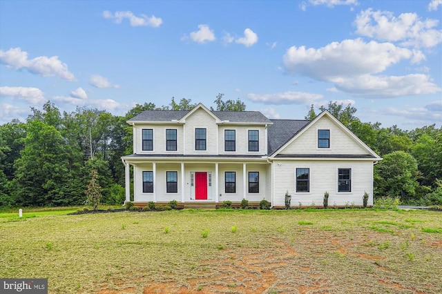  - colonial inspired home featuring a porch and a front yard
