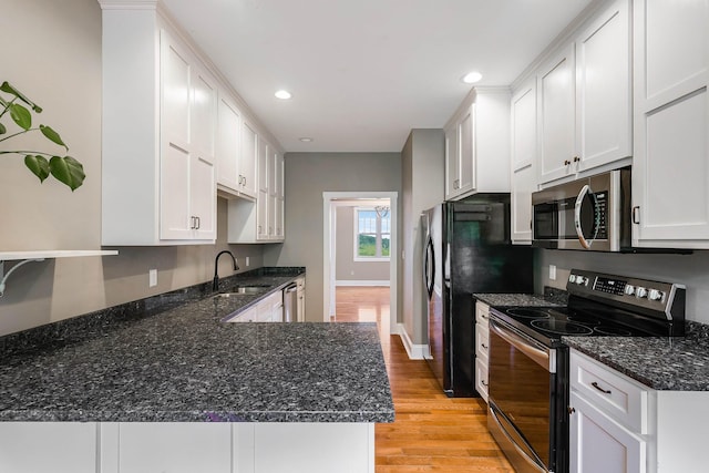 17 Mcilwee Ln, Staunton, VA 24401 - kitchen featuring appliances with stainless steel finishes, light wood-type flooring, a sink, white cabinetry, and recessed lighting