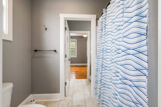 17 Mcilwee Ln, Staunton, VA 24401 - bathroom featuring toilet, baseboards, ceiling fan, tile patterned flooring, and curtained shower