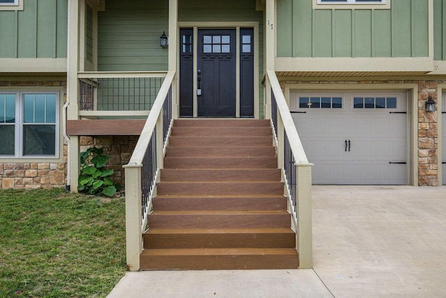 17 Mcilwee Ln, Staunton, VA 24401 - entrance to property featuring stone siding, board and batten siding, concrete driveway, and a garage