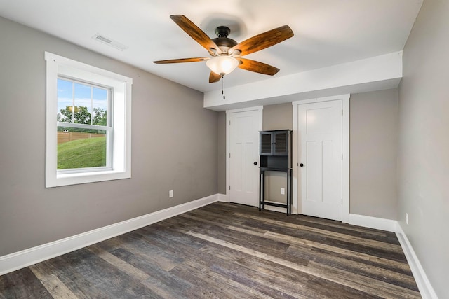 17 Mcilwee Ln, Staunton, VA 24401 - unfurnished bedroom featuring dark wood-style flooring, baseboards, and a ceiling fan