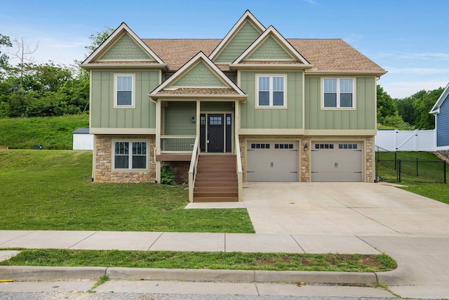 17 Mcilwee Ln, Staunton, VA 24401 - view of front of home with stone siding, board and batten siding, a garage, and driveway