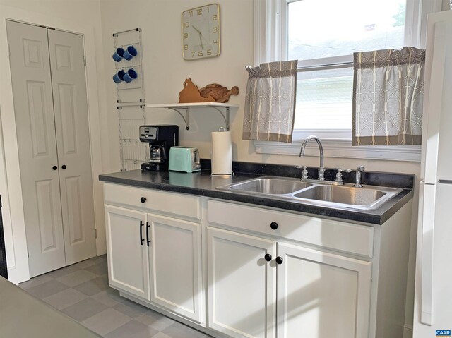 239 Shamrock Rd, Charlottesville, VA 22903 - kitchen featuring open shelves, dark countertops, a sink, and plenty of natural light