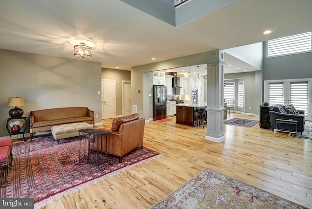 12400 Eustace Dr, Bumpass, VA 23024 - living room with decorative columns, light wood-type flooring, baseboards, and recessed lighting