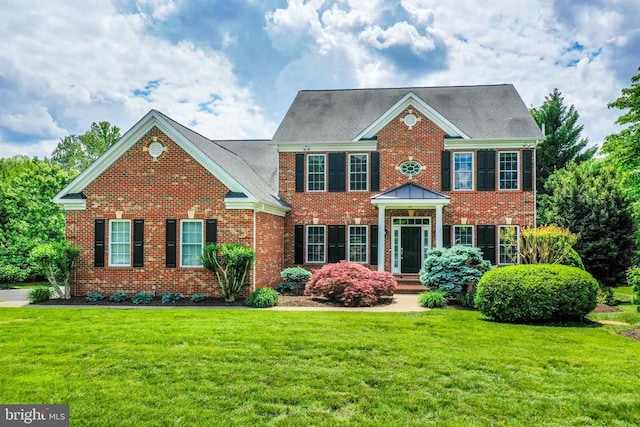 12400 Eustace Dr, Bumpass, VA 23024 - colonial home with brick siding and a front yard
