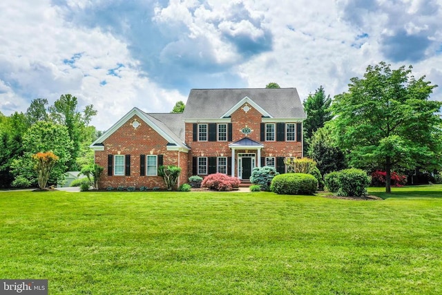 12400 Eustace Dr, Bumpass, VA 23024 - georgian-style home featuring brick siding and a front yard