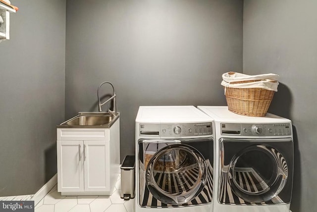 12400 Eustace Dr, Bumpass, VA 23024 - clothes washing area with washing machine and dryer, cabinet space, and light tile patterned floors