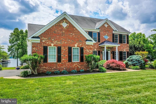 12400 Eustace Dr, Bumpass, VA 23024 - colonial home with brick siding and a front yard