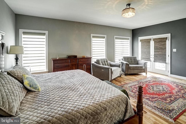 12400 Eustace Dr, Bumpass, VA 23024 - bedroom with access to outside, wood finished floors, and baseboards