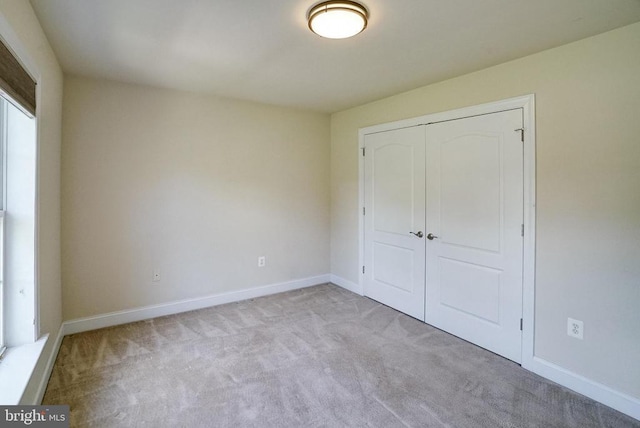 12400 Eustace Dr, Bumpass, VA 23024 - unfurnished bedroom with carpet, a closet, and baseboards