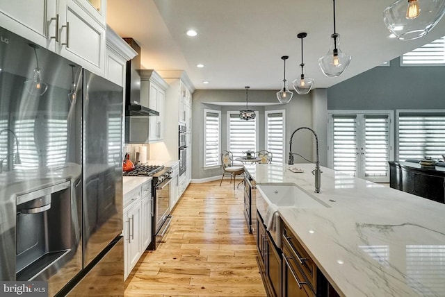 12400 Eustace Dr, Bumpass, VA 23024 - kitchen with appliances with stainless steel finishes, a sink, light wood-style flooring, recessed lighting, and white cabinetry