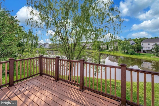  - deck featuring a water view and a residential view