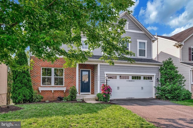  - view of front of home featuring an attached garage, asphalt driveway, a front lawn, and brick siding