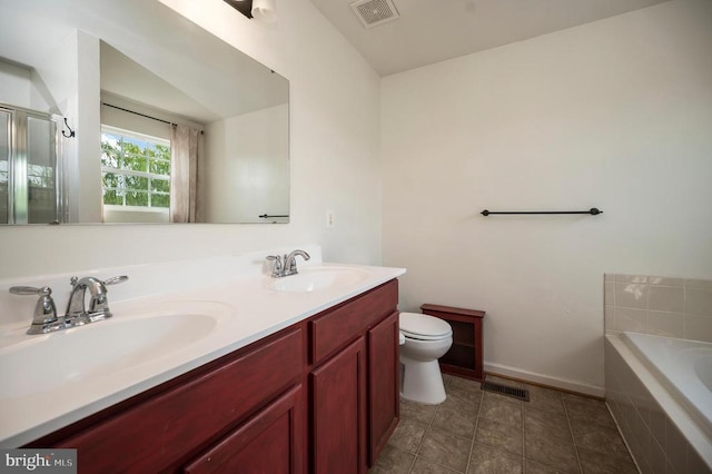  - bathroom featuring double vanity, a garden tub, a stall shower, and tile patterned flooring