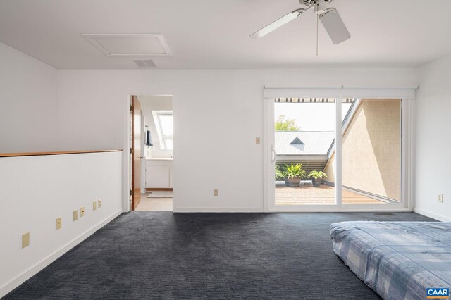 unfurnished bedroom with access to exterior, carpet flooring, attic access, baseboards, and ensuite bath