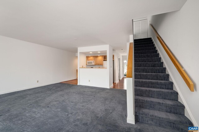 stairs featuring carpet flooring, baseboards, and recessed lighting