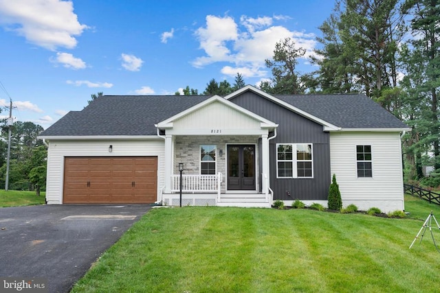 Richards Ferry Rd, Richardsville, VA 22736 - view of front of home featuring covered porch, a garage, asphalt driveway, a front yard, and roof with shingles