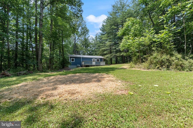236 Laurel Dr, Madison, VA 22727 - view of green lawn featuring a deck and a forest view