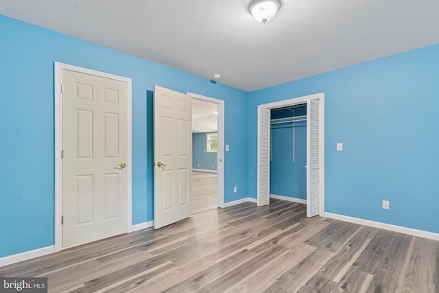 236 Laurel Dr, Madison, VA 22727 - unfurnished bedroom featuring a closet and wood finished floors