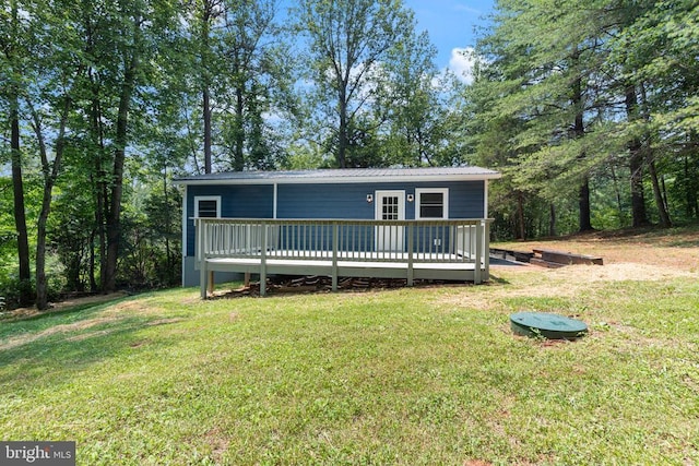236 Laurel Dr, Madison, VA 22727 - view of front of house featuring a deck, a front yard, and a metal roof