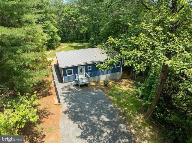 236 Laurel Dr, Madison, VA 22727 - view of front facade with driveway, a metal roof, and a forest view