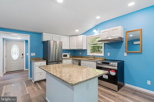 236 Laurel Dr, Madison, VA 22727 - kitchen featuring appliances with stainless steel finishes, under cabinet range hood, white cabinets, wood finished floors, and a center island