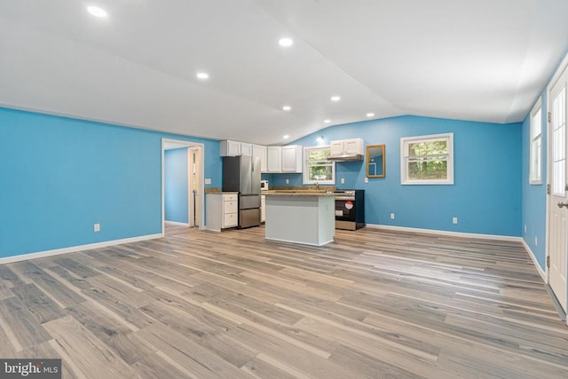 236 Laurel Dr, Madison, VA 22727 - kitchen with appliances with stainless steel finishes, open floor plan, vaulted ceiling, light wood-style flooring, and white cabinets