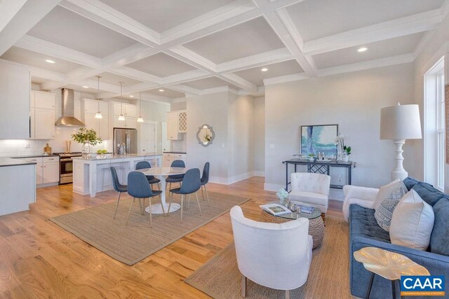 living area with beamed ceiling, light wood-type flooring, and coffered ceiling