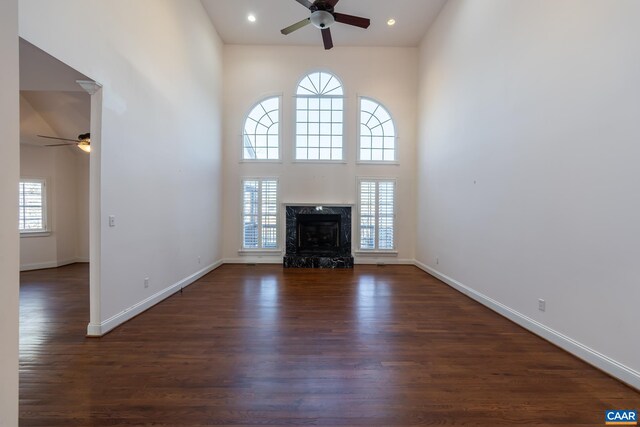 278 Foxmoor Rd, Troy, VA 22974 - unfurnished living room featuring a healthy amount of sunlight, a towering ceiling, and ceiling fan