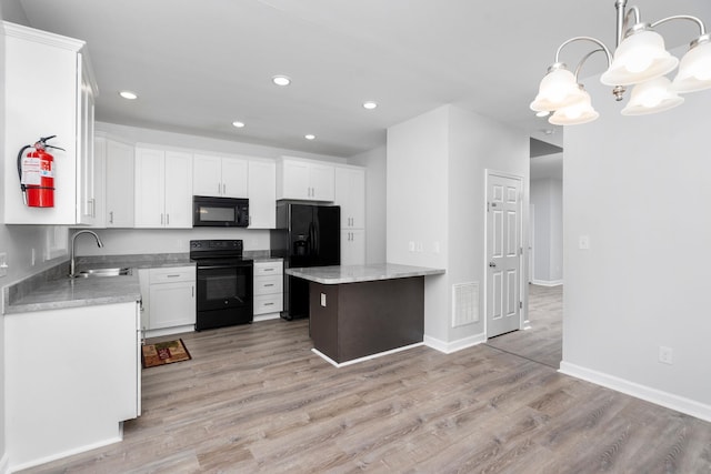 59,61,61A,63,63 Woodlee Road, Staunton, VA 24401 - kitchen featuring black appliances, light wood finished floors, recessed lighting, white cabinets, and decorative light fixtures