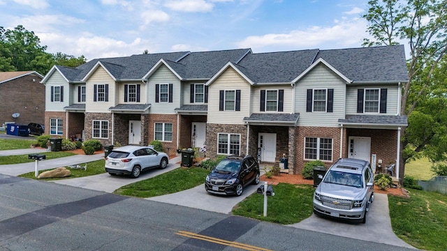59,61,61A,63,63 Woodlee Road, Staunton, VA 24401 - view of property featuring a shingled roof, brick siding, and a front yard