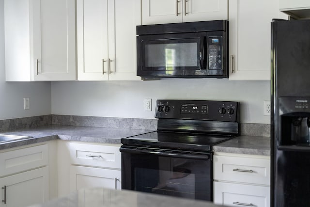 59,61,61A,63,63 Woodlee Road, Staunton, VA 24401 - kitchen with black appliances and white cabinetry
